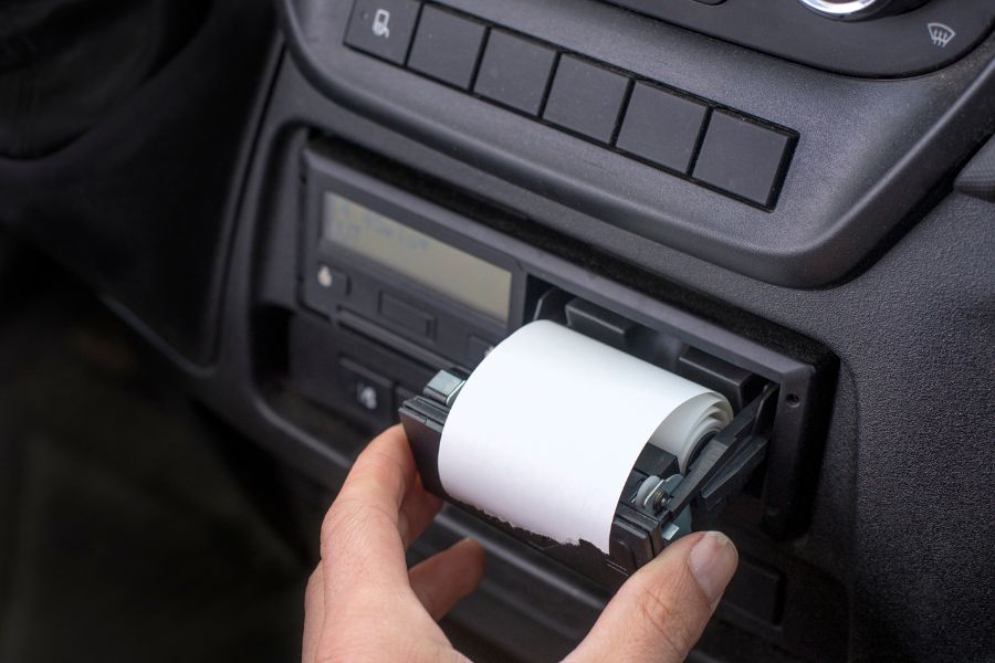A tachograph in a company vehicle is operated by an employee.